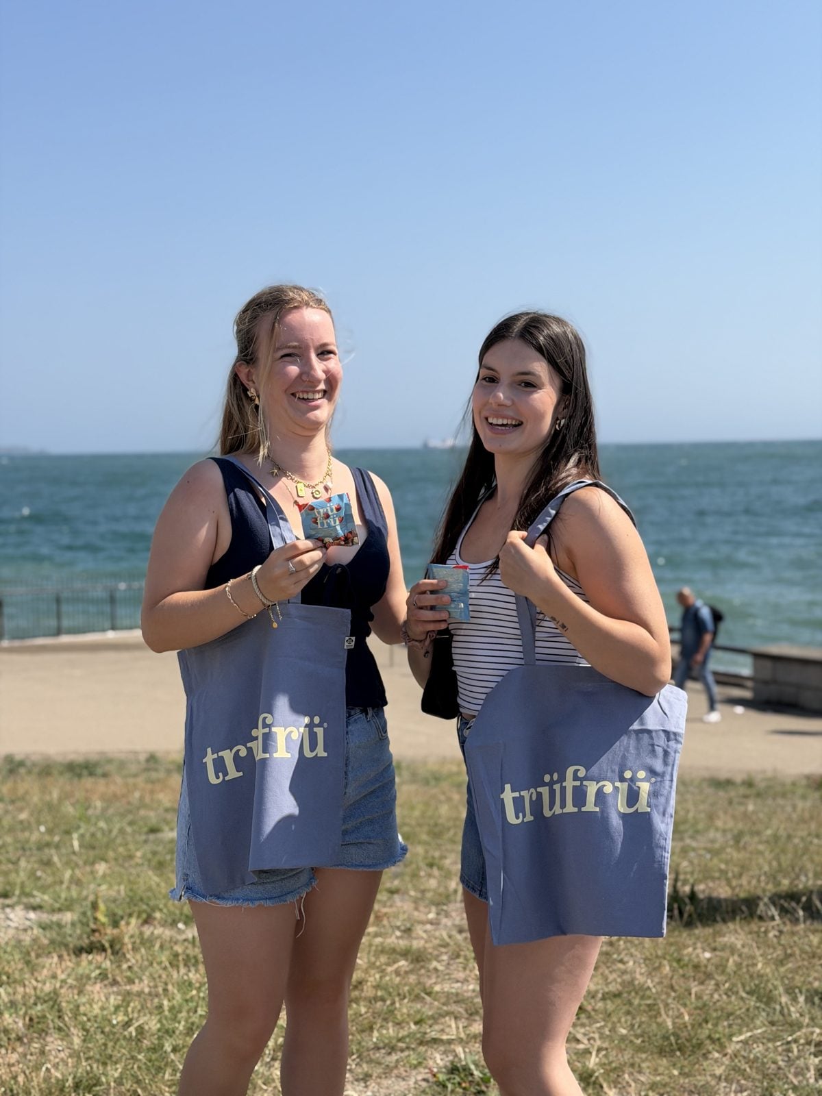 Two women by the sea in Dún Laoghaire with Trü Frü tote bags.