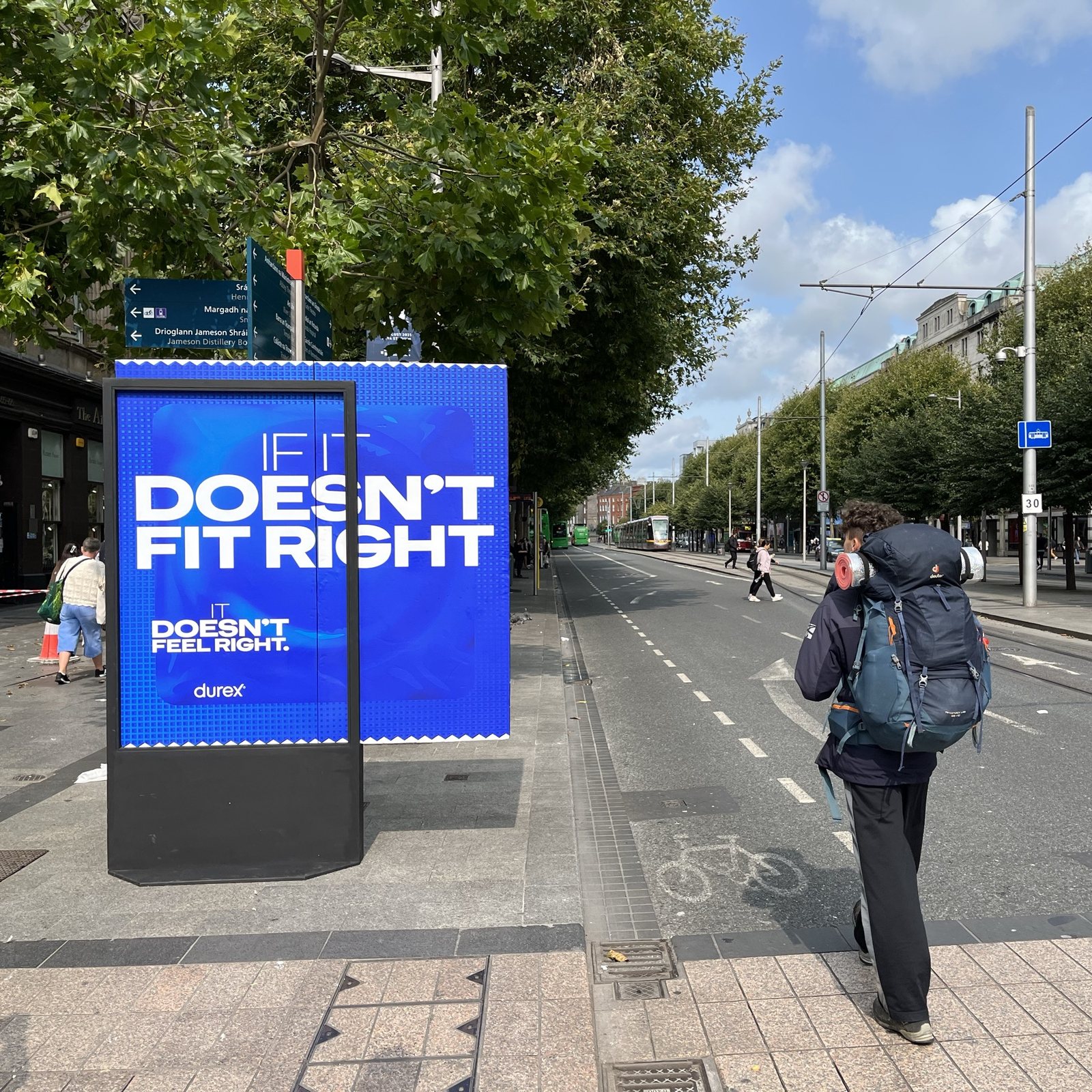 A Durex panel on O’Connell Street, Dublin, a condom graphic bursting out of the frame, reading If it doesn’t fit right, it doesn’t feel right.