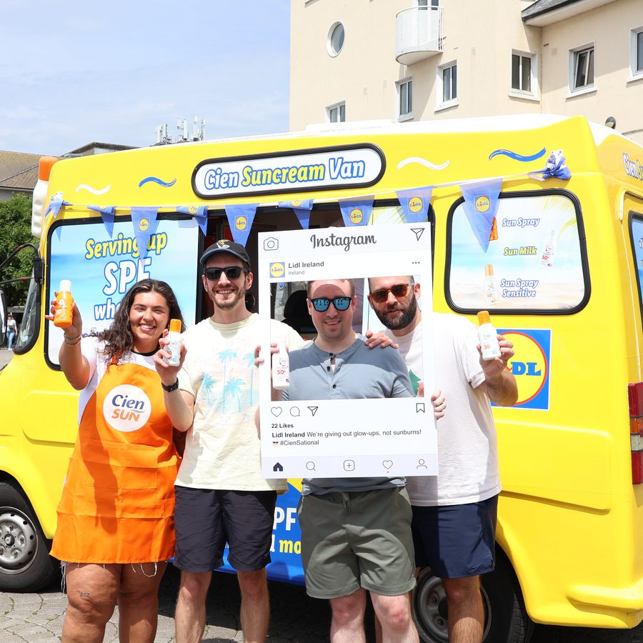 The team in front of the Sun Cream Van.